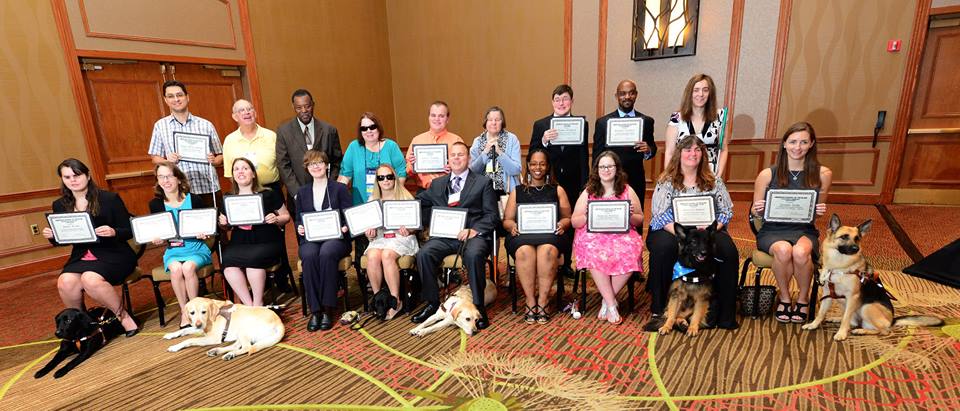 ACB group photo with certificates and dogs