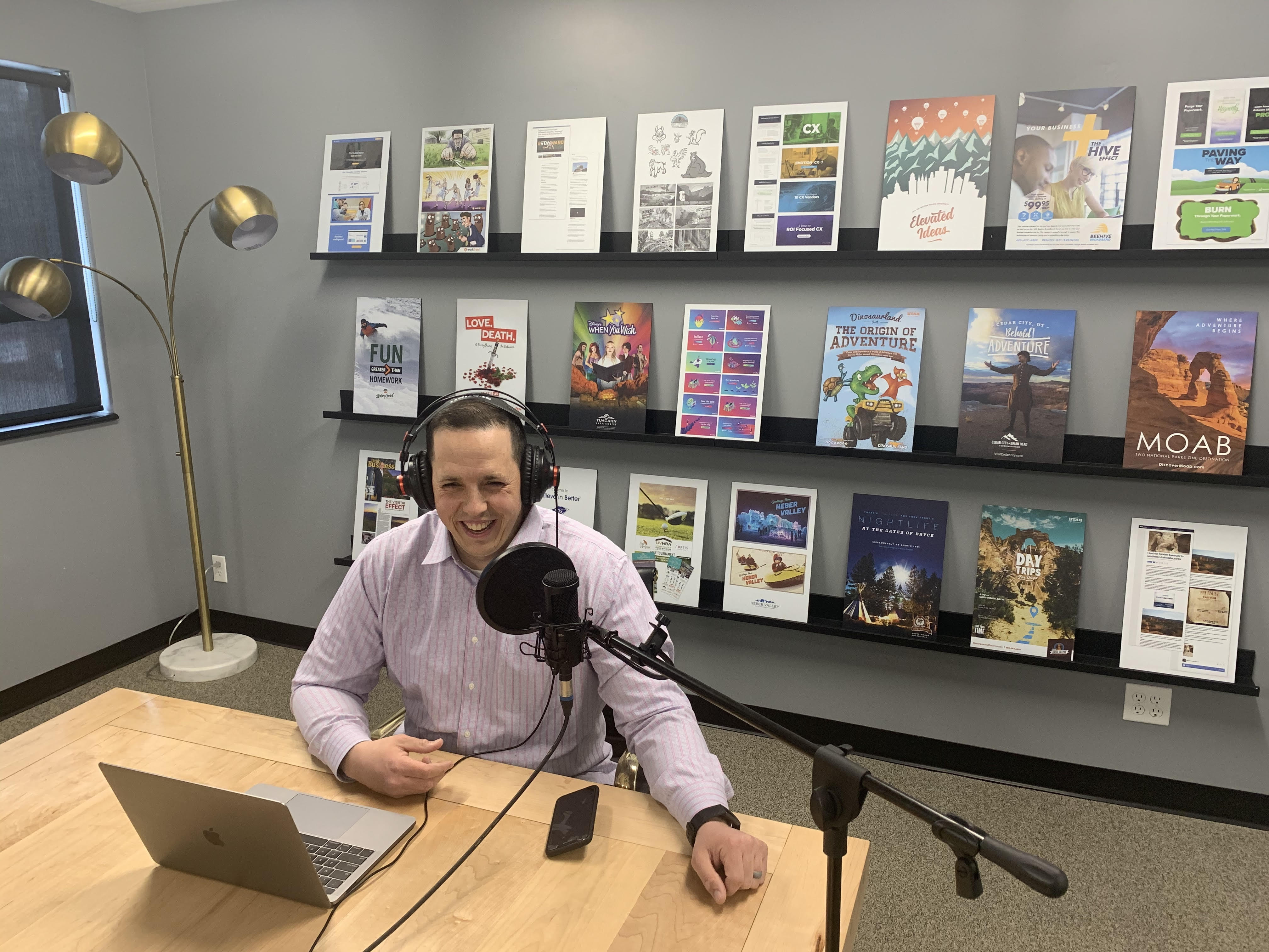 Adam Stoker in conference room recording podcast