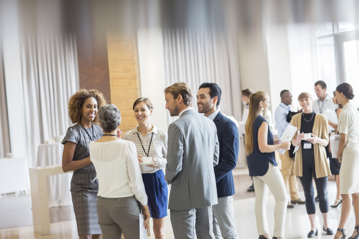 group of people networking at a conference