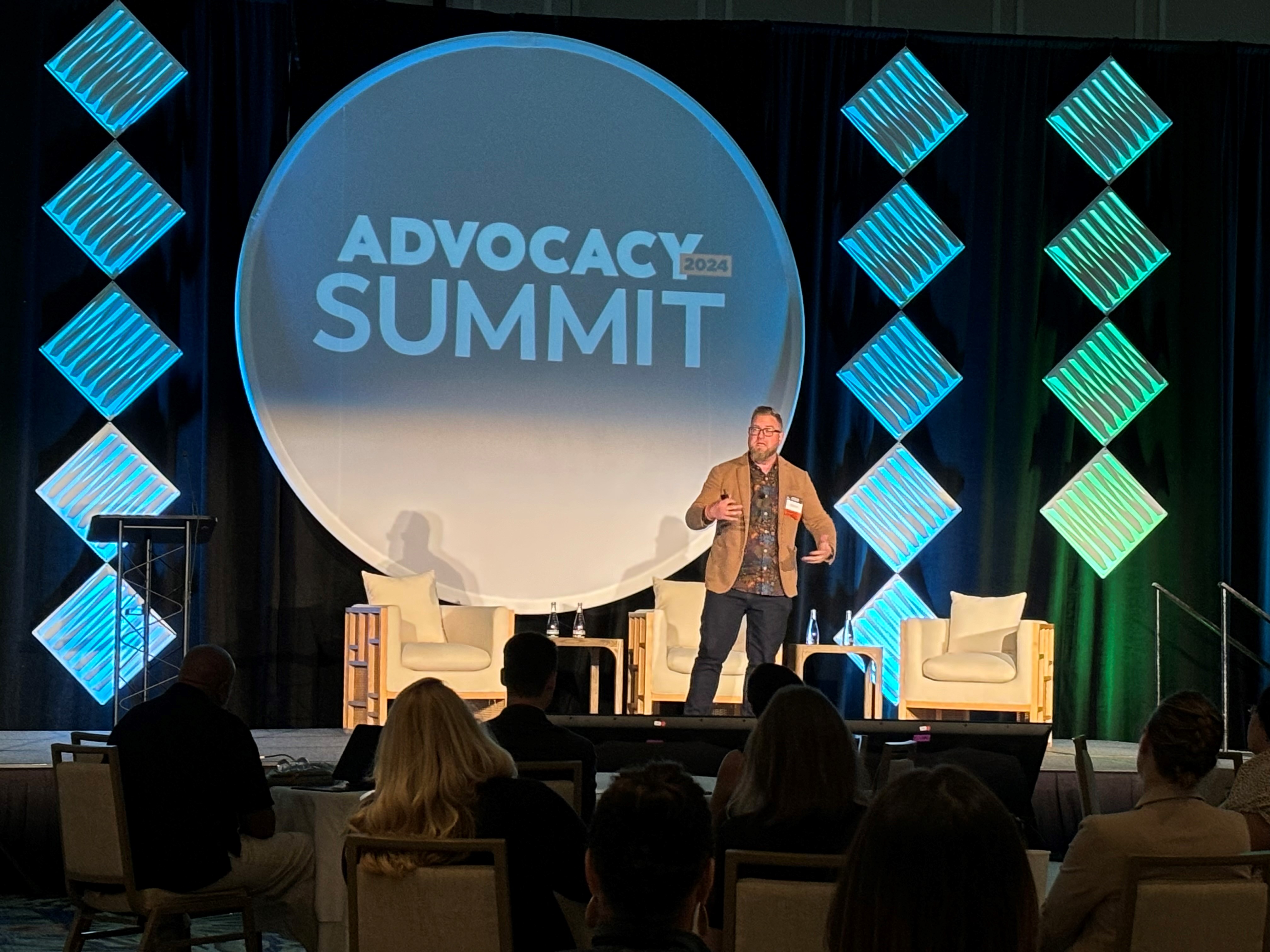 Josiah Brown on stage at advocacy summit