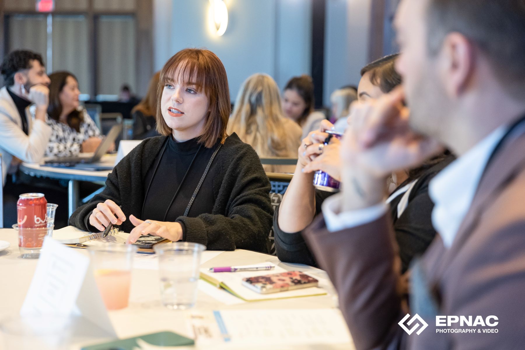 woman leading discussion at a roundtable