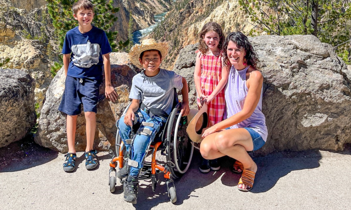 family posing for a photo on a hike