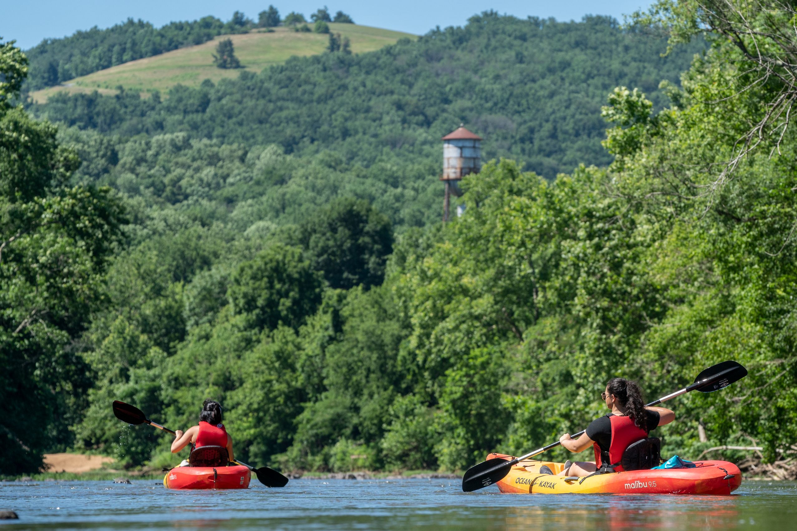 two people kayaking on the river