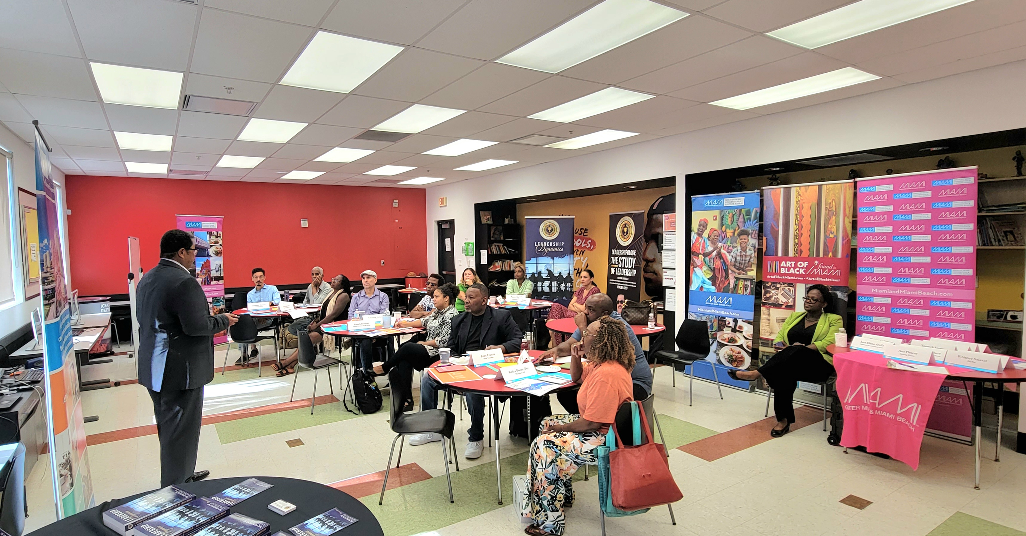 Greater Miami CVB team sitting in a classroom while a speaker presents