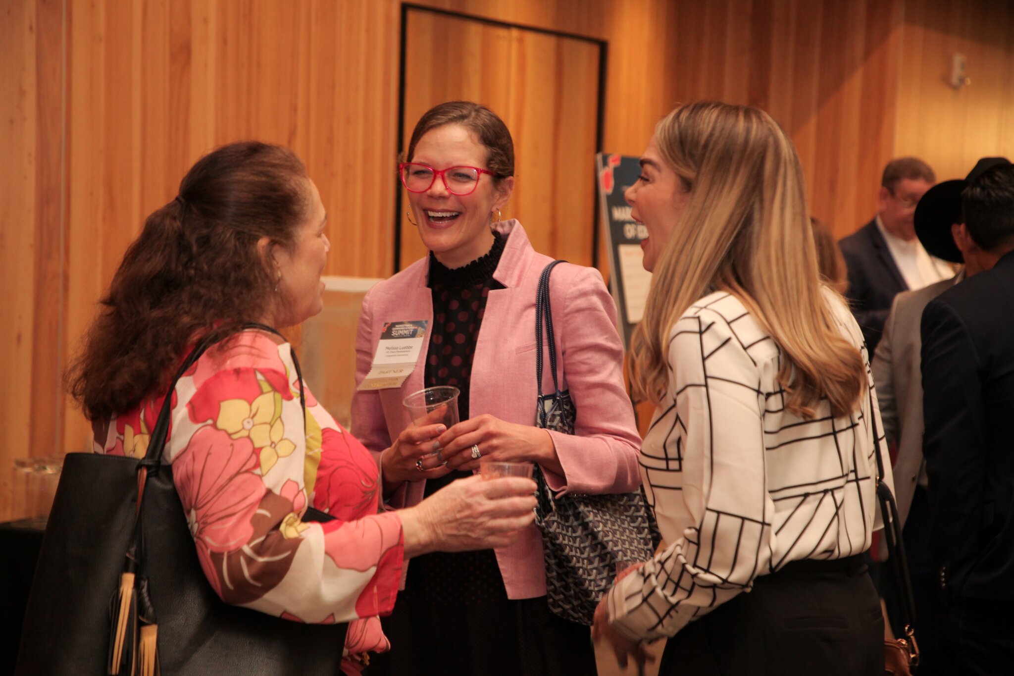 group of women networking at a conference