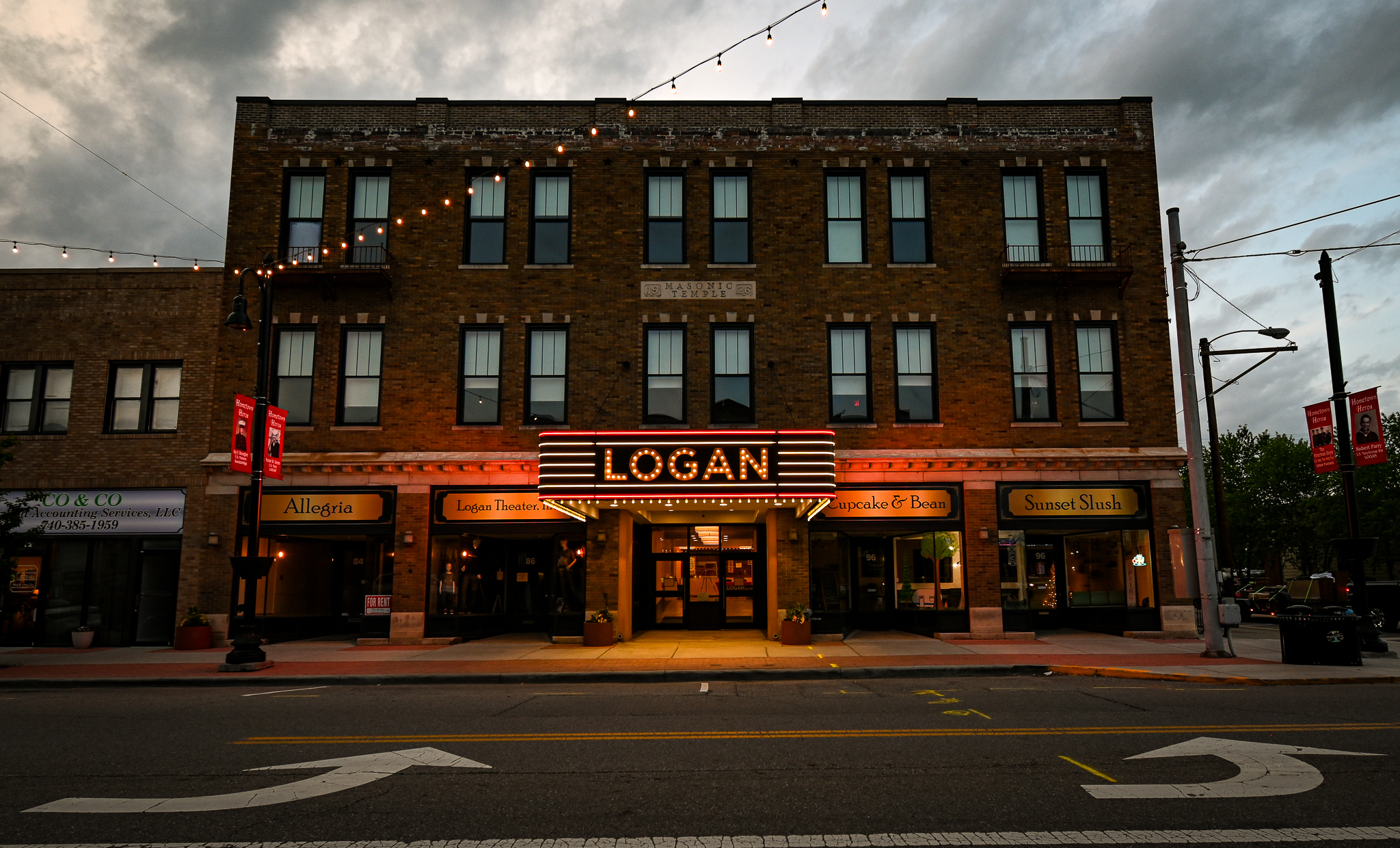 a building with its lights on. The sign says &quot;LOGAN&quot; in large letters