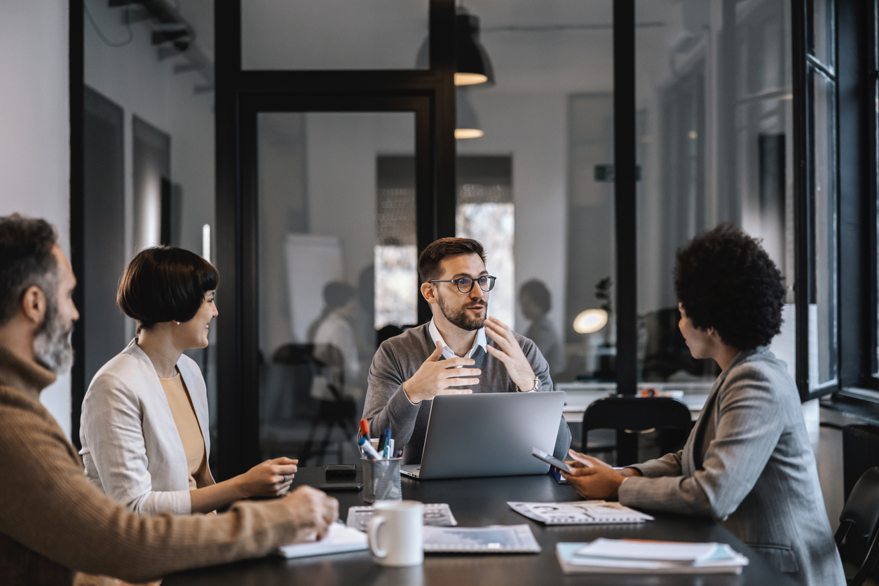 man leads presentation to his colleagues