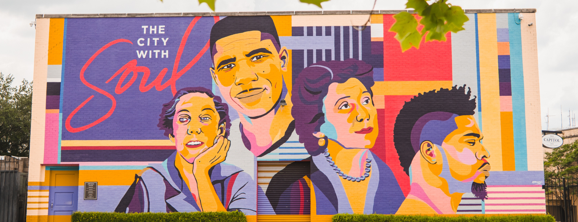 Icons Mural in Jackson, MS that includes colorful depictions of the city's notable citizens