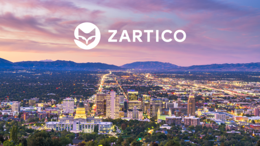 Zartico logo over colorful image of city in the distance