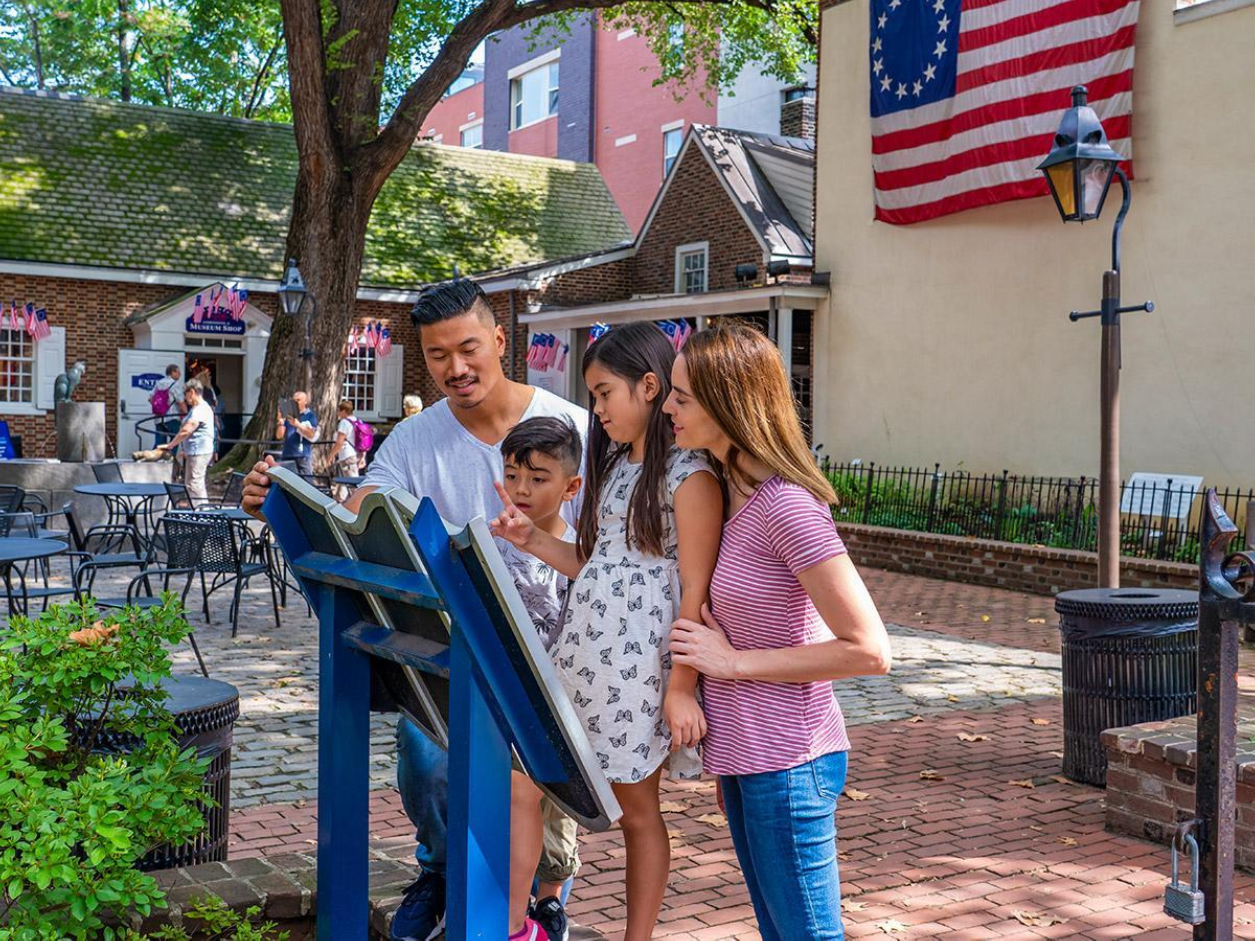 family reads a plaque