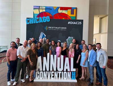 group of attendees pose in front of the Annual Convention sign in Chicago