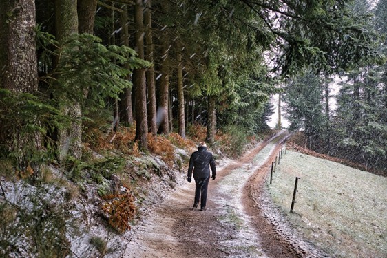 person walking on a train alone