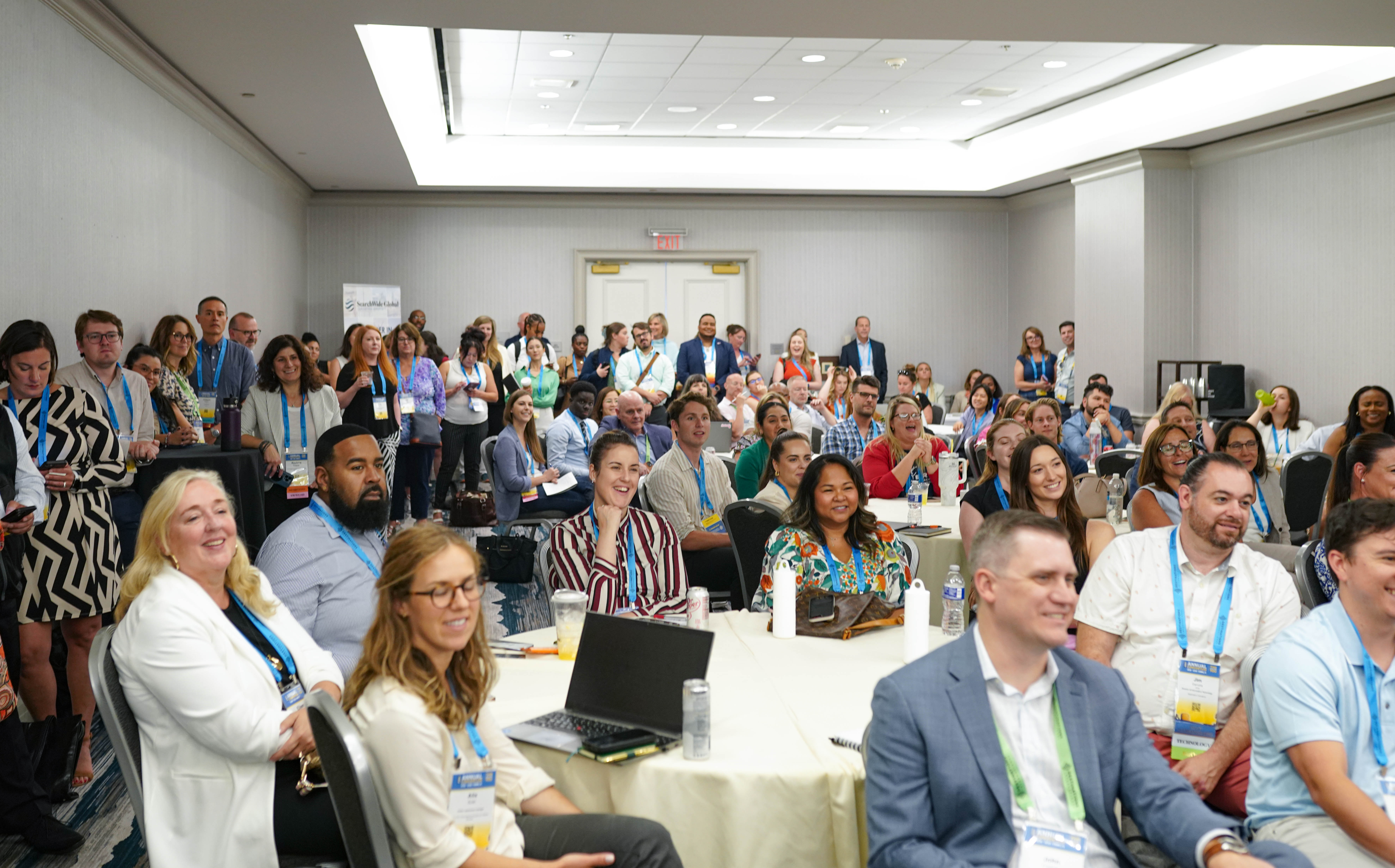 annual convention attendees watching a session
