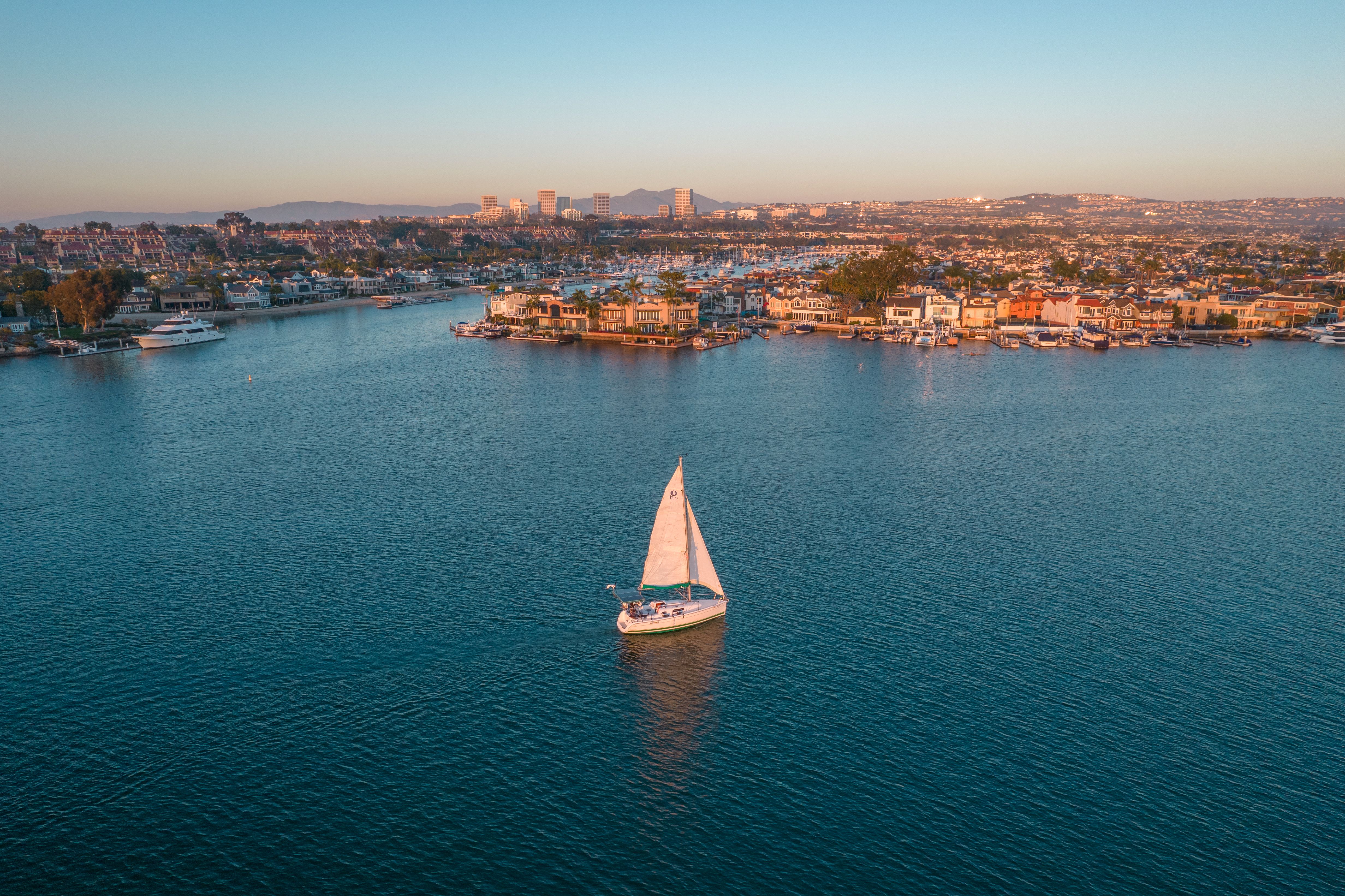 sailboat in the harbor in Newport Beach, CA