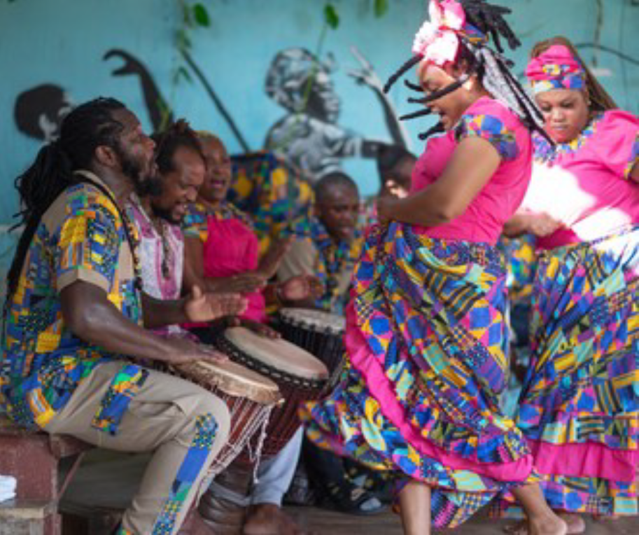 People in bright clothing dancing