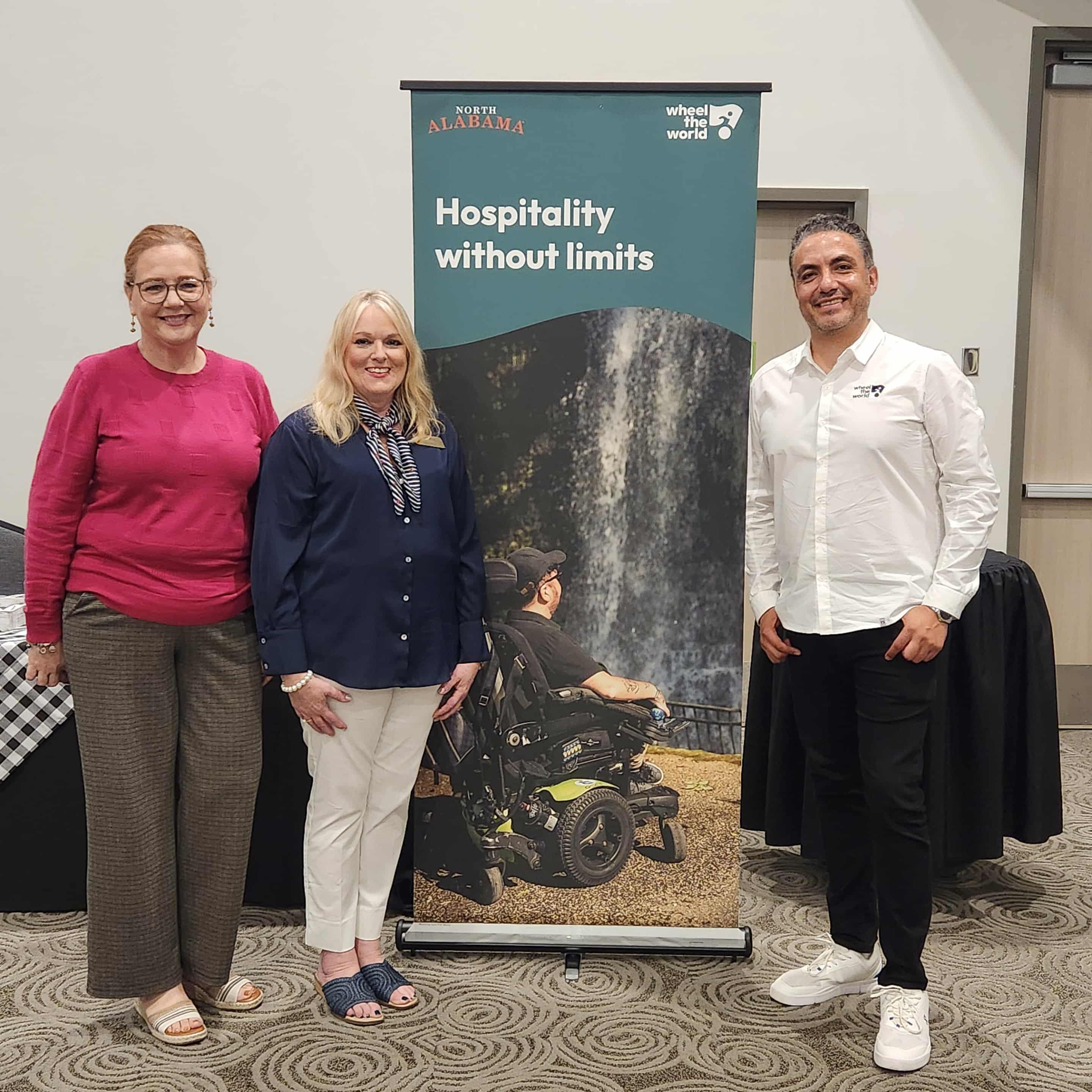 North Alabama team in front of banner that says Hospitality without Limits