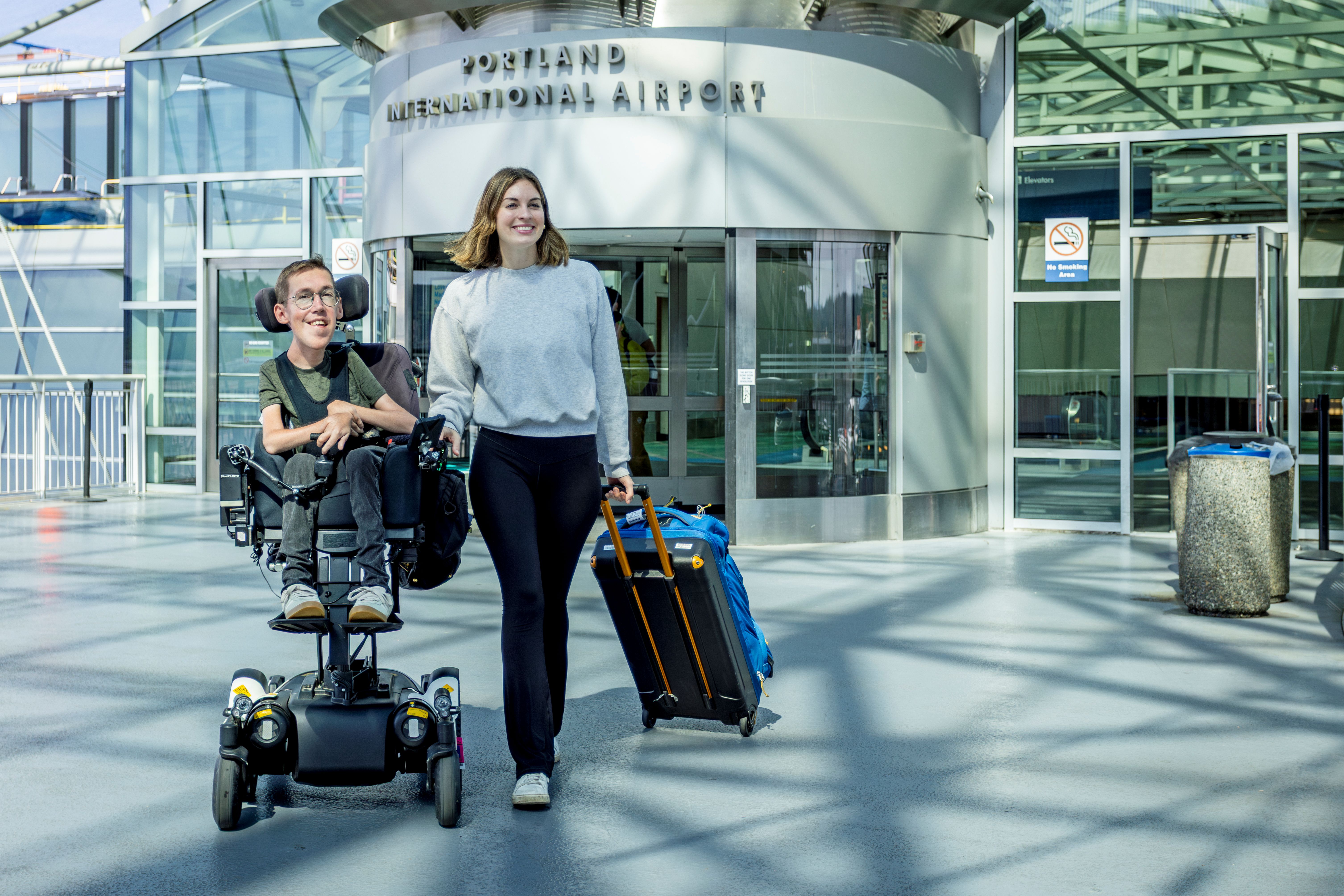 a couple navigating the PDX airport
