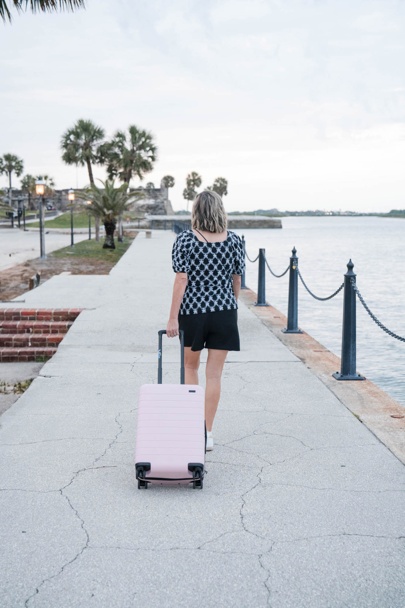woman walking with suitcase
