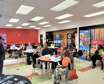 Greater Miami CVB team sitting in a classroom while a speaker presents