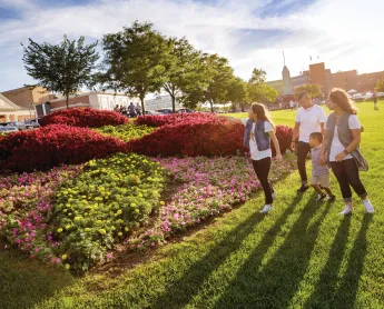 family walking through garden