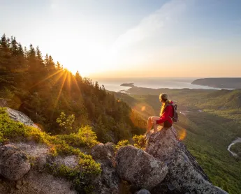 hiker sits and admires the view