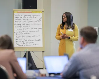 CDME student presenting in front of class