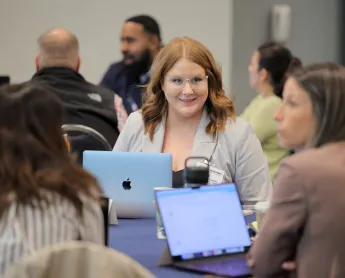 CDME student talking to classmates
