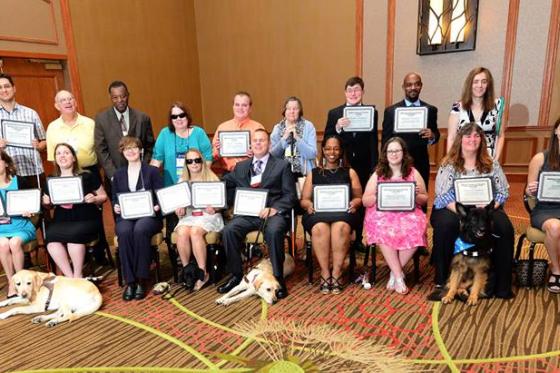 ACB group photo with certificates and dogs