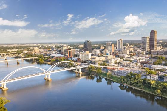 drone shot of Little Rock, Arkansas showcasing the bridge and many tall buildings in the background