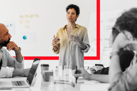 woman presenting to her colleagues