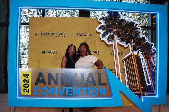 attendees by the Annual Convention sign