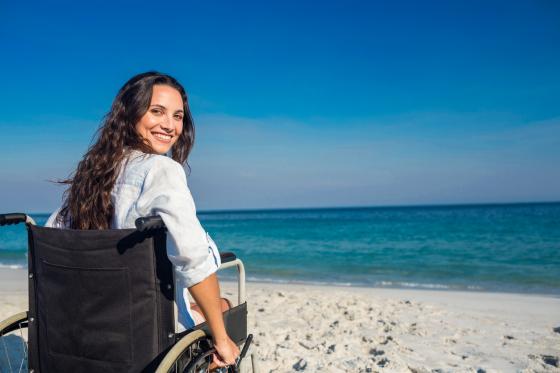 woman in a wheelchair on the beach