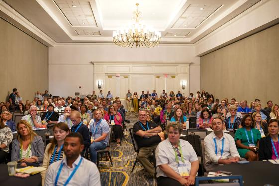 room of attendees at Annual Convention listening to the speaker