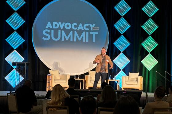Josiah Brown on stage at advocacy summit