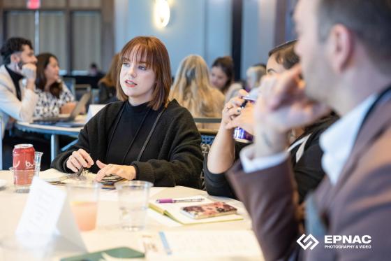 woman leading discussion at a roundtable
