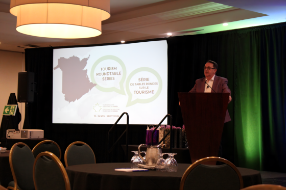 speaker presenting about new tourism roundtable series