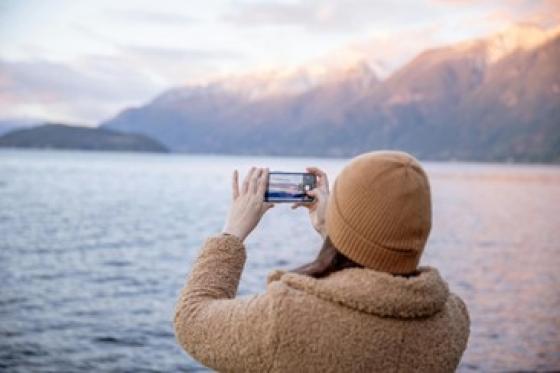 woman taking a photo of the view