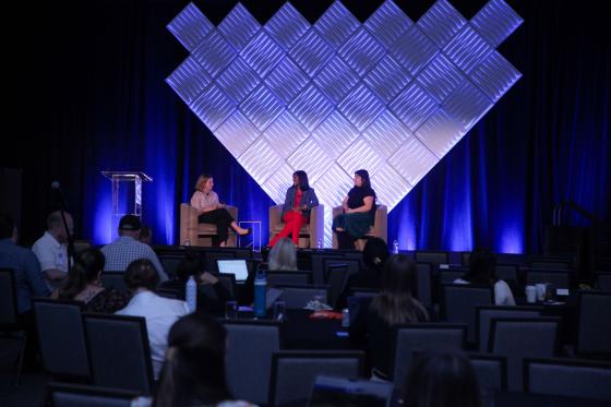 marketing and communications summit panelists on stage