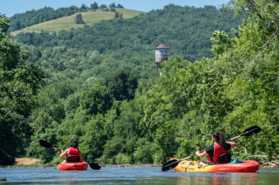 two people kayaking on the river