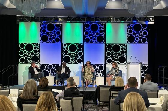 panelists on stage at CEO Summit