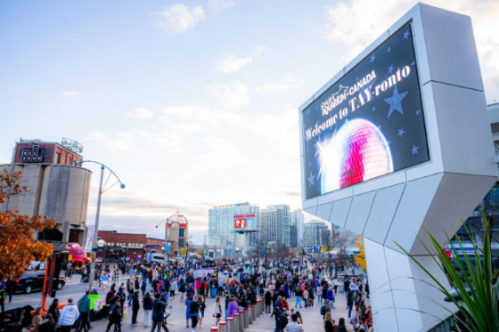 sign outside stadium that reads "Welcome to TAY-ronto"