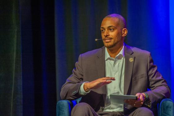 Donald Lilley presenting on stage at BizOps Summit