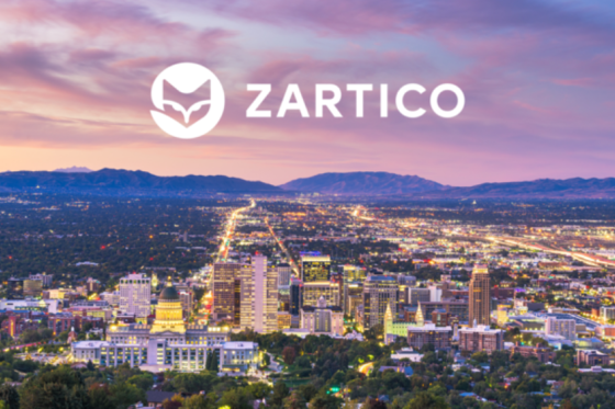 Zartico logo over colorful image of city in the distance