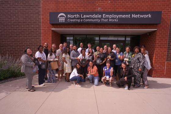 group photo of From Hive to Thrive participants in front of the North Lawndale Employment Network sign