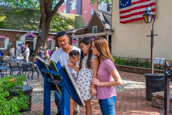family reads a plaque