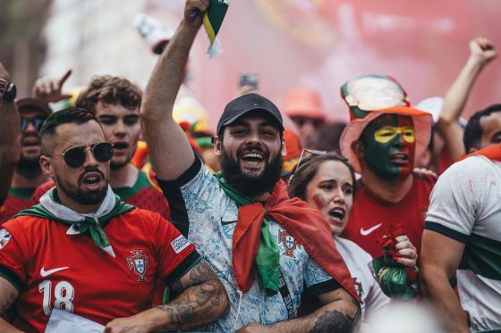 soccer fans cheering in the crowd