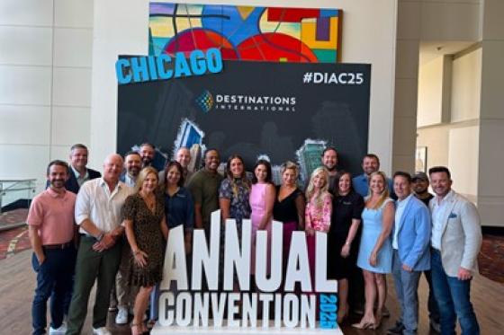 group of attendees pose in front of the Annual Convention sign in Chicago