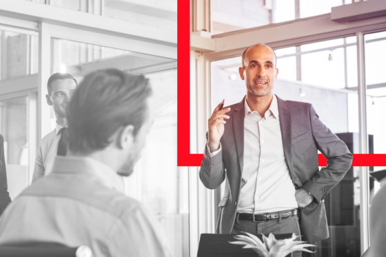 leader speaks to room of employees