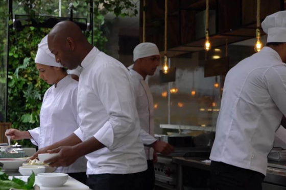 chefs working together to prepare a meal