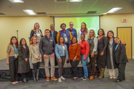 Social Impact Committee pose for a photo at their committee meeting in Spokane